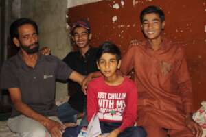 Hamza with his family at home